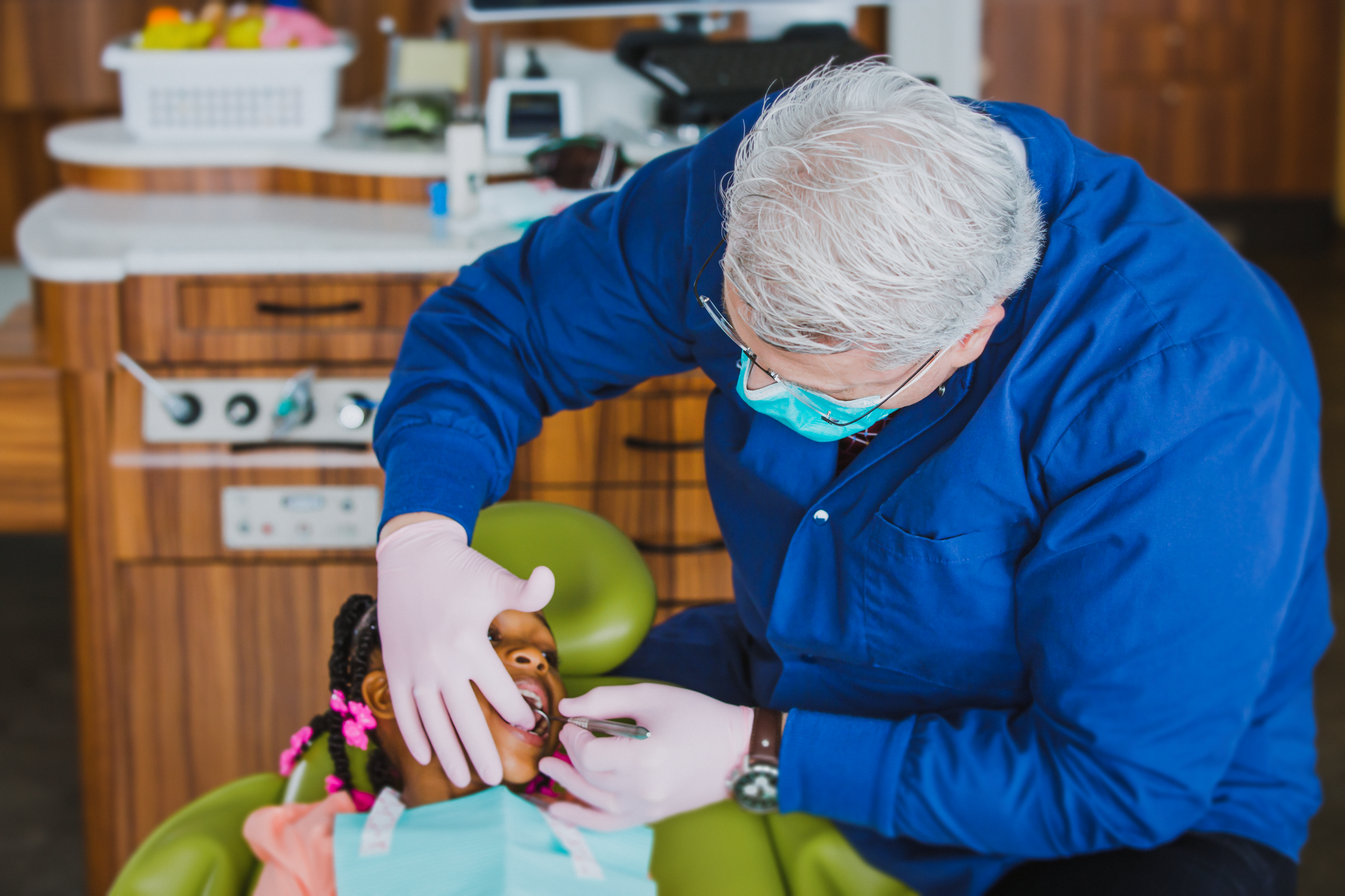 dentist examining child patient dentist examining child patient
