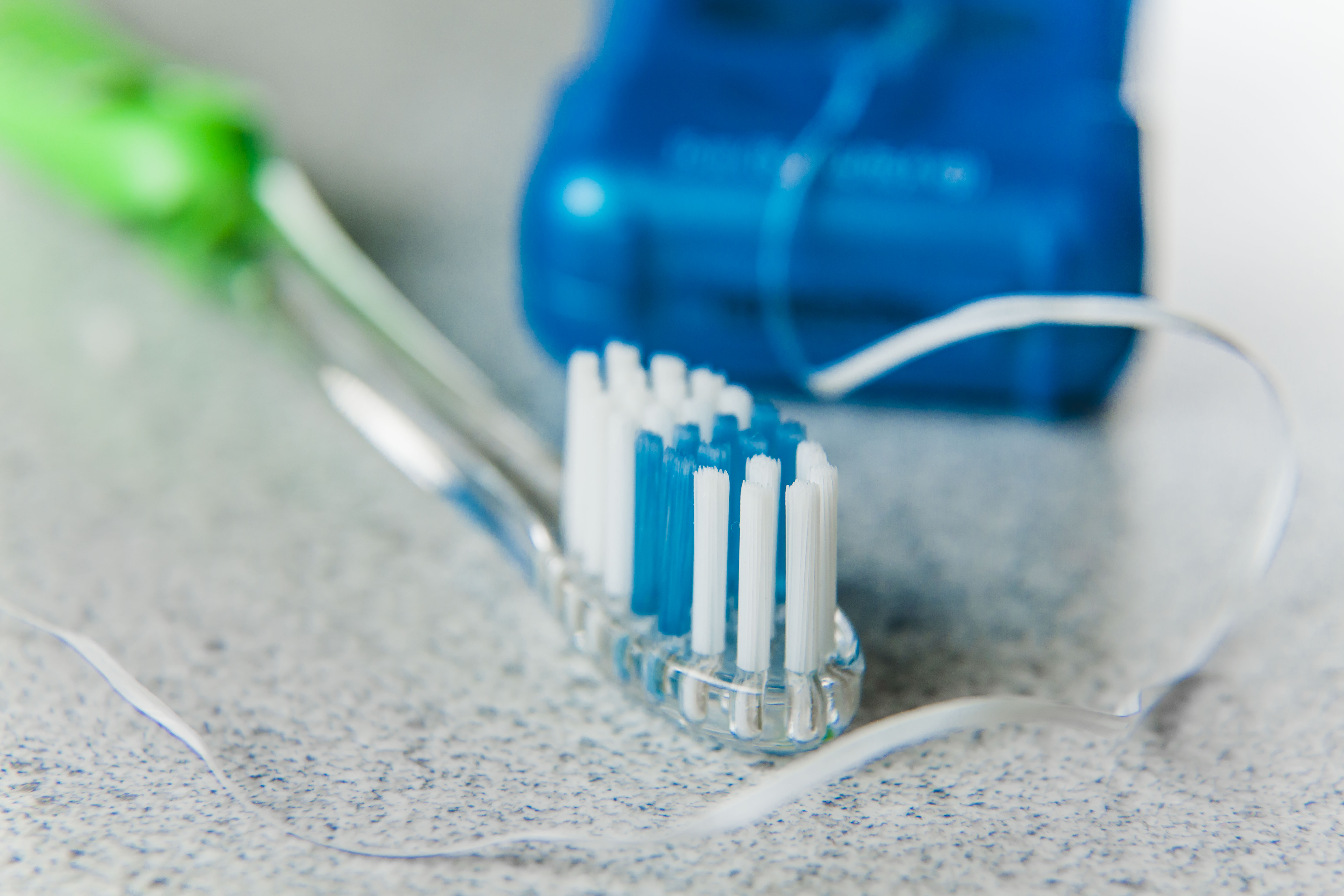 floss and toothbrush