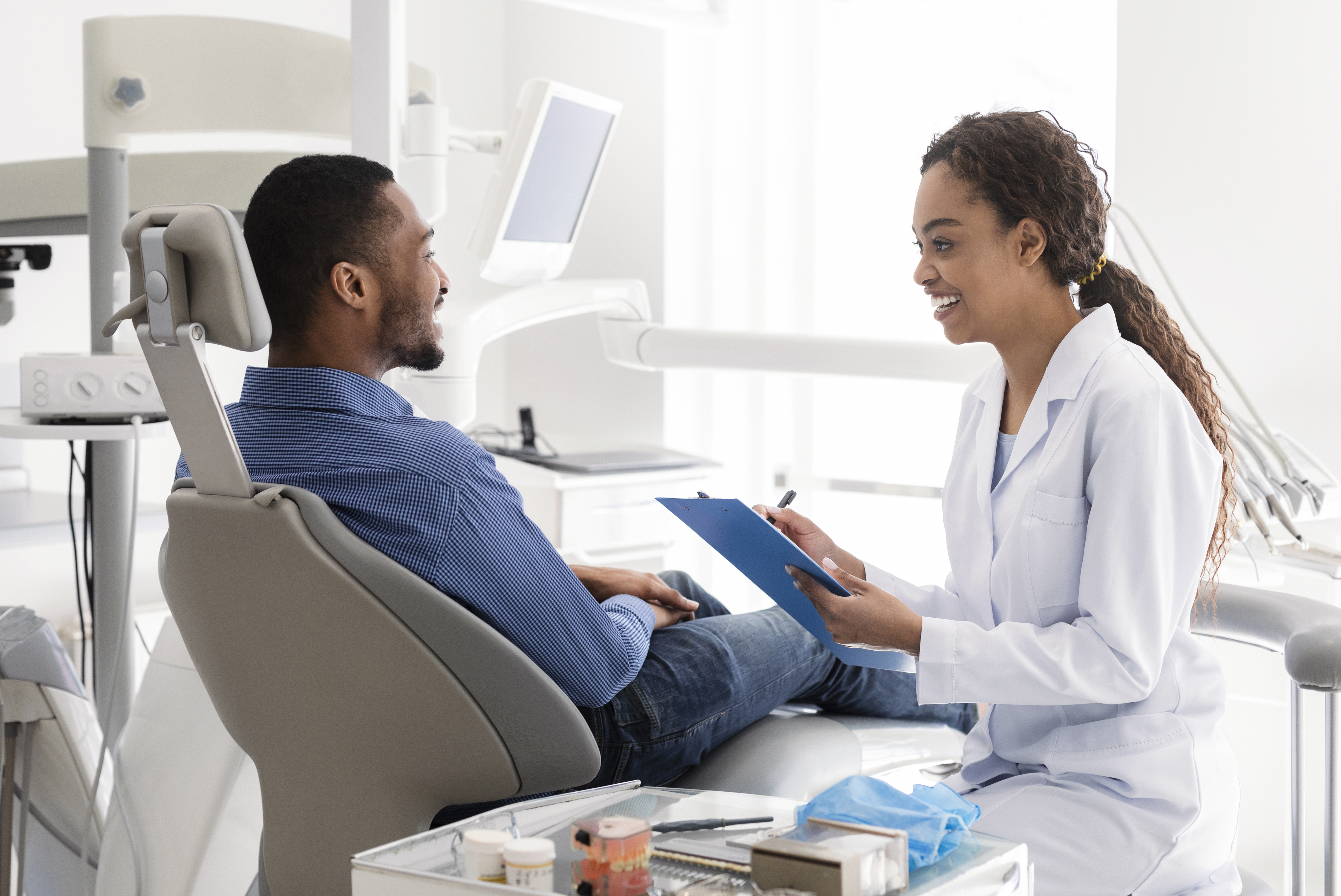 Patient receiving a consult from the dentist Patient receiving a consult from the dentist