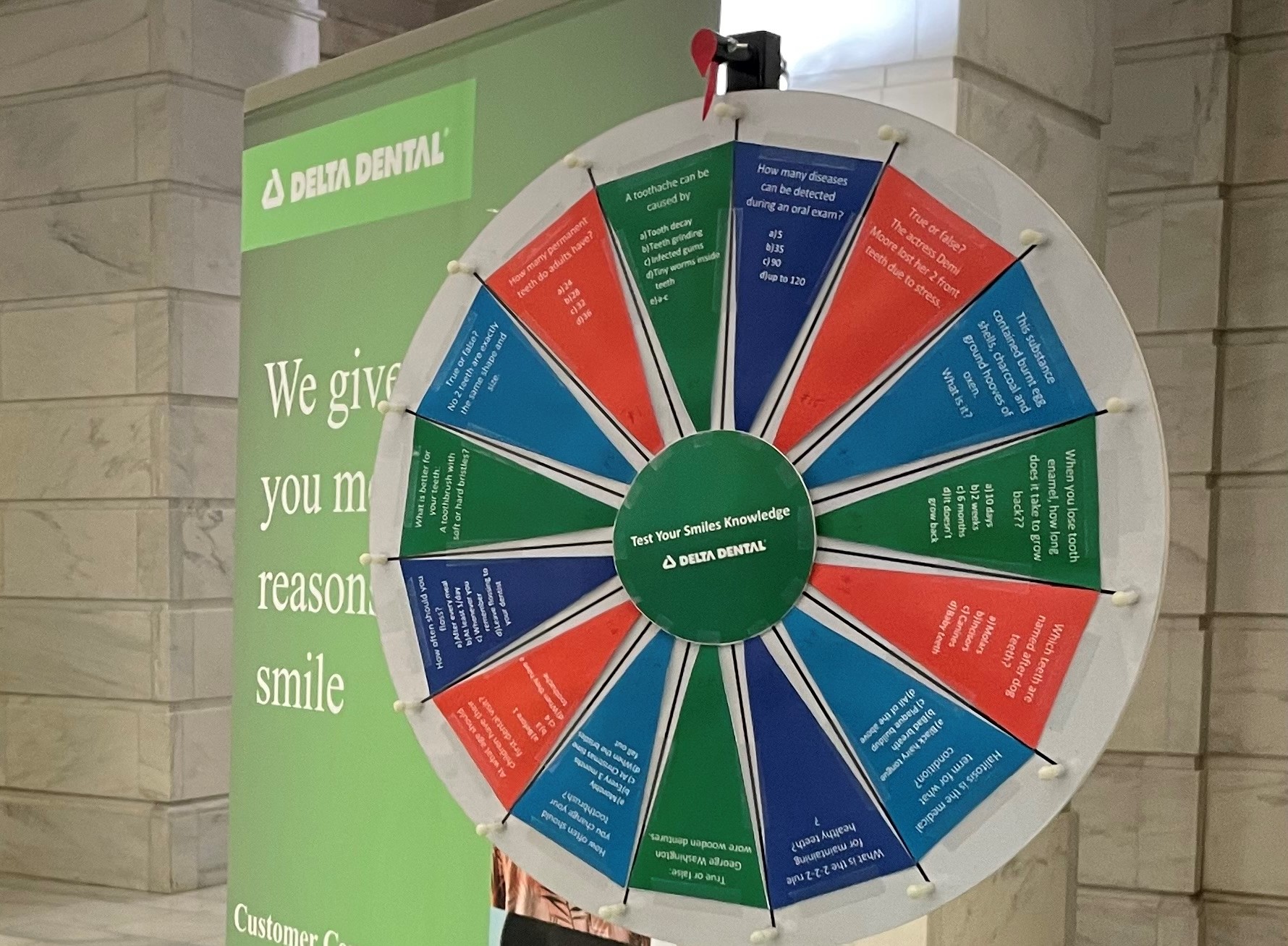 The Delta Dental of Arkansas prize wheel with oral health, hygiene and history trivia questions