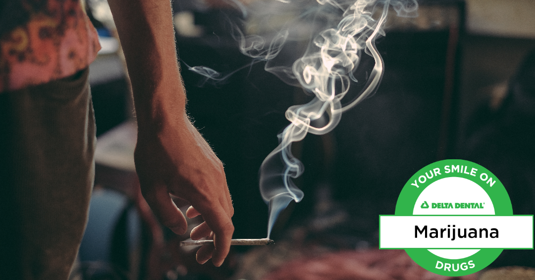 smile on drugs, marijuana with logo Hand holding a joint