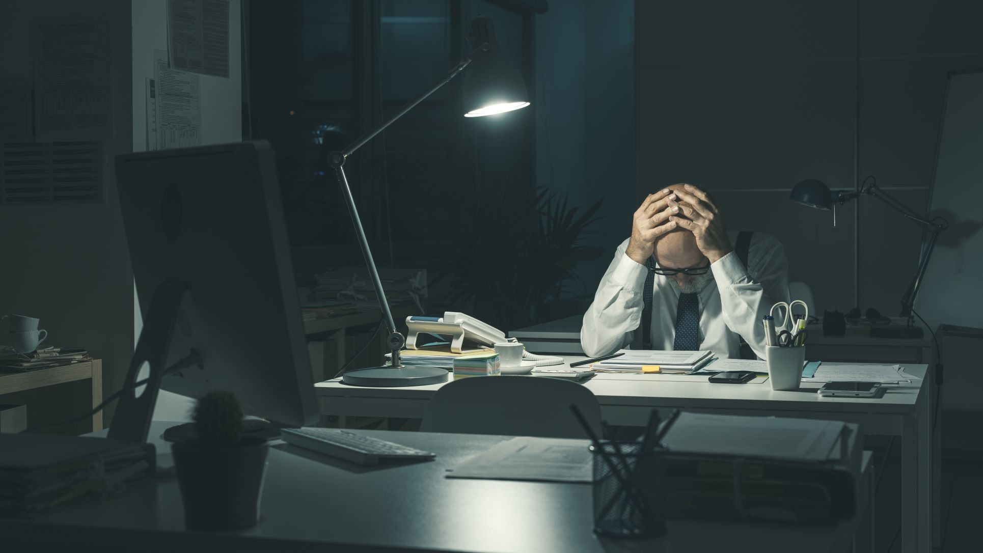 Stressed insurance agent working overtime