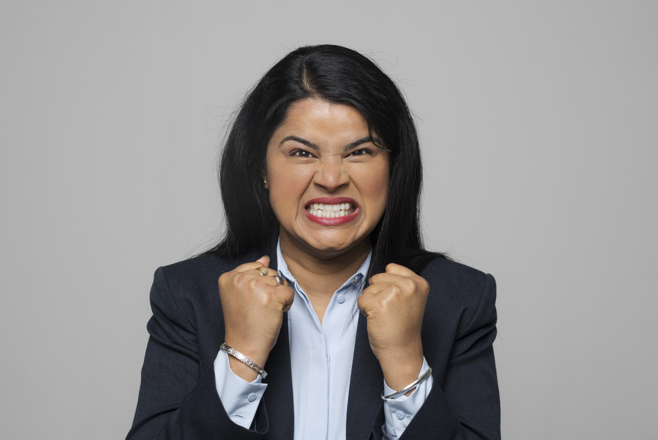 woman clenching her teeth woman clenching her teeth