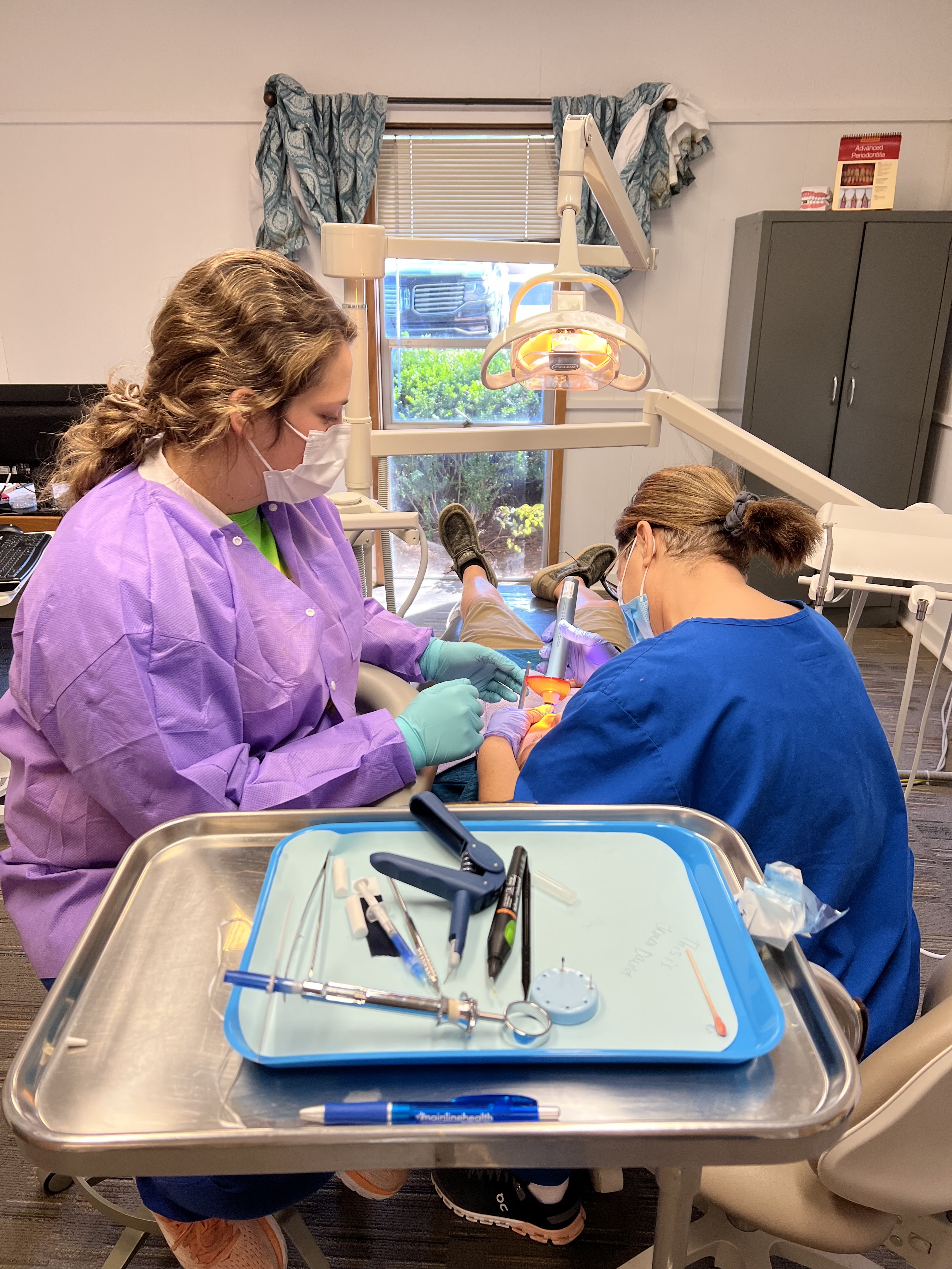 Star City School Dental Clinic, staff treating patient