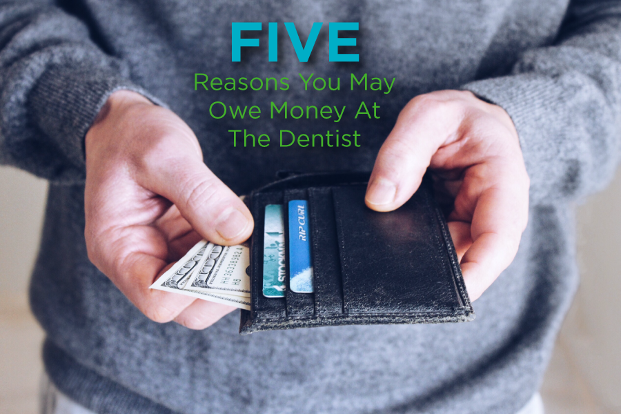 Image of man holding wallet while thinking about unexpected costs at the dentist