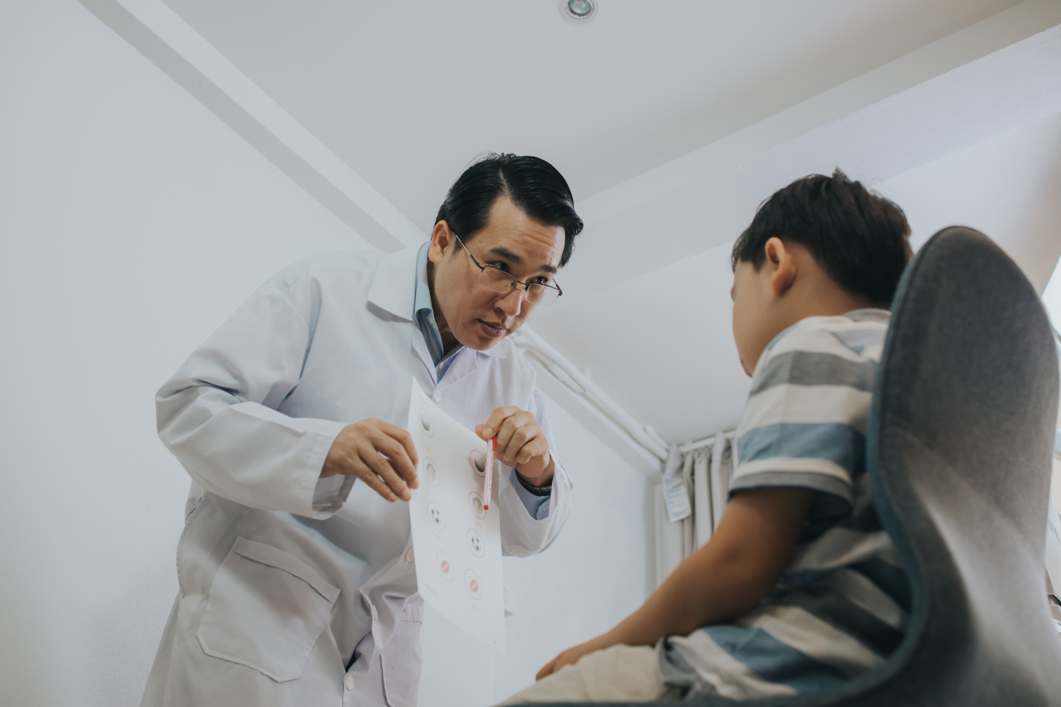 Eye doctor and child Child having an eye exam