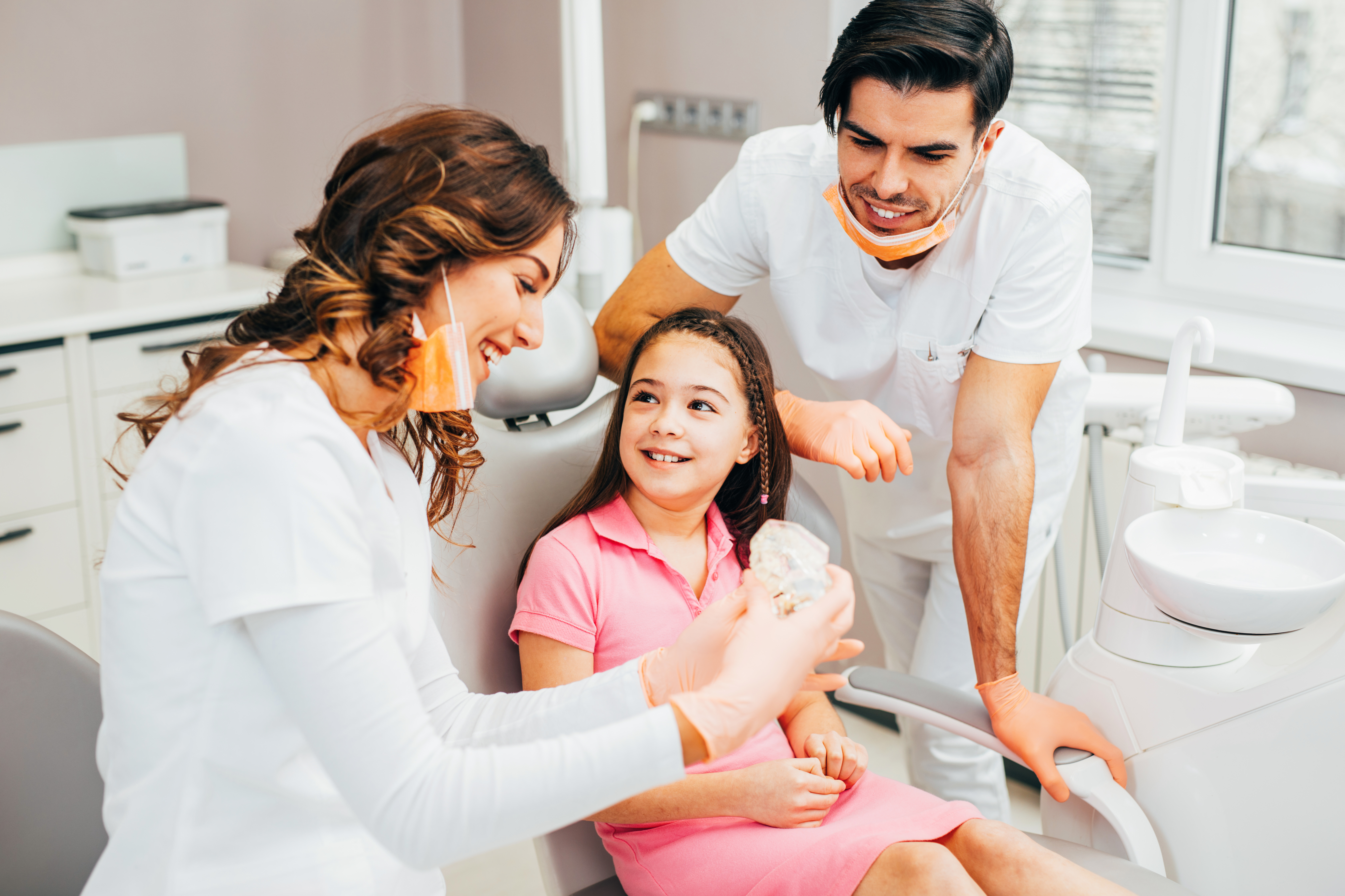 child talking to dentists