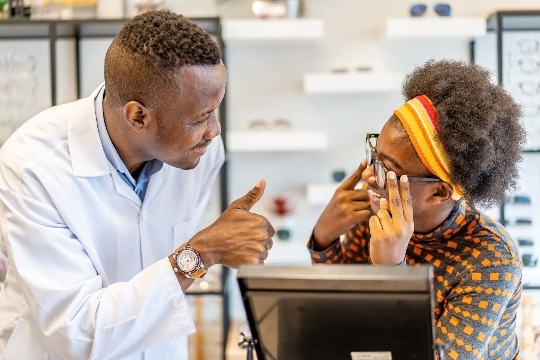 optometrist advising customer optometrist advising customer
